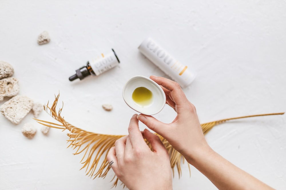 Person holding a CBD cream